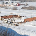 entire centre section of the roof is collapsed under the snow