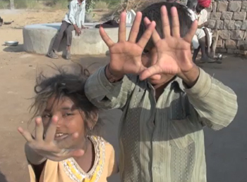 picture of kids holding up hands